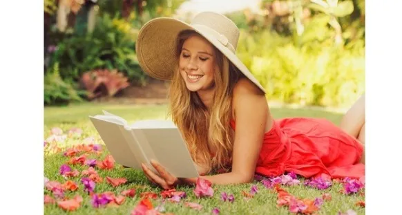 Young Woman Reading Book Outside