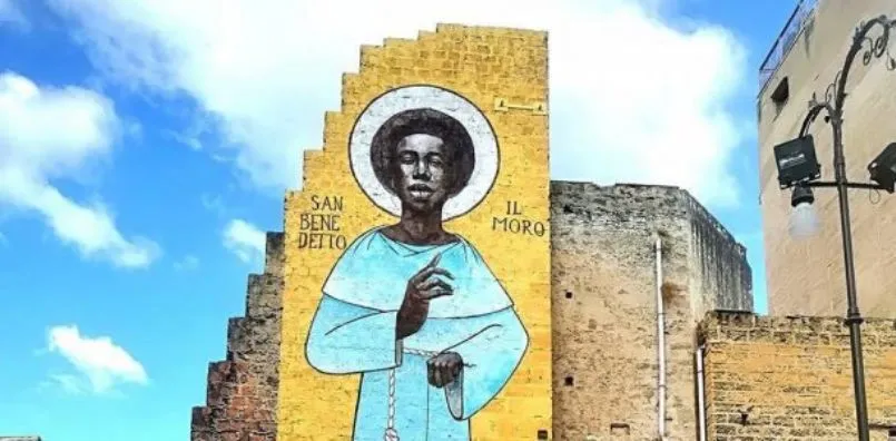 Un santo africano sui muri di Palermo, la città che ama i migranti